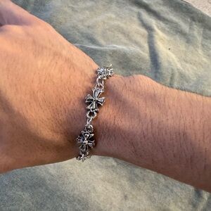 Silver Cross charm bracelet floral design